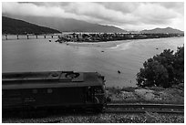 Train, bay, and village. Vietnam (black and white)