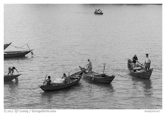 Fishermen on small boats. Vietnam (black and white)