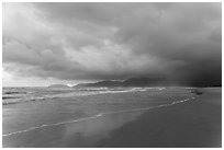 Stormy sunrise on beach. Vietnam (black and white)