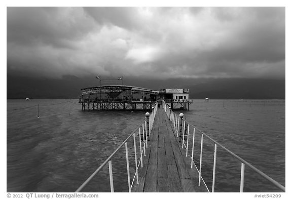 Pier leading to restaurant on stilts. Vietnam