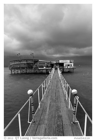 Boarwal, offshore restaurant, and threatening clouds. Vietnam