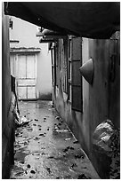 Alley and rain. Vietnam (black and white)