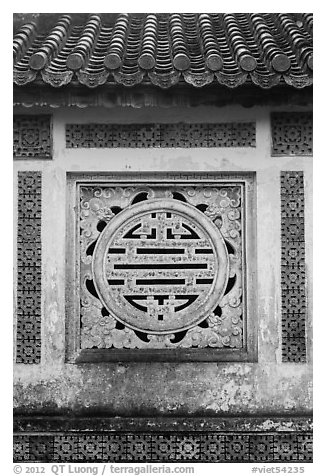 Window in the motif of Chinese symbol meaning Longevity, citadel. Hue, Vietnam (black and white)