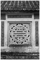 Window in the motif of Chinese symbol meaning Longevity, citadel. Hue, Vietnam (black and white)