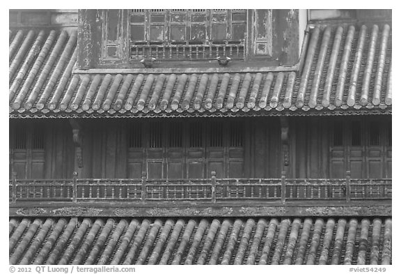 Detail of tile roof and wooden palace, citadel. Hue, Vietnam