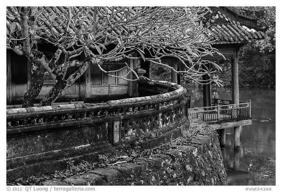 Luu Khiem Lake edge with stone fence and pavilion, Tu Duc Tomb. Hue, Vietnam (black and white)