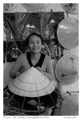 Woman making the Vietnamese conical hat. Hue, Vietnam