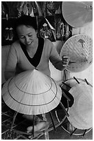 Woman crafting conical hat. Hue, Vietnam (black and white)