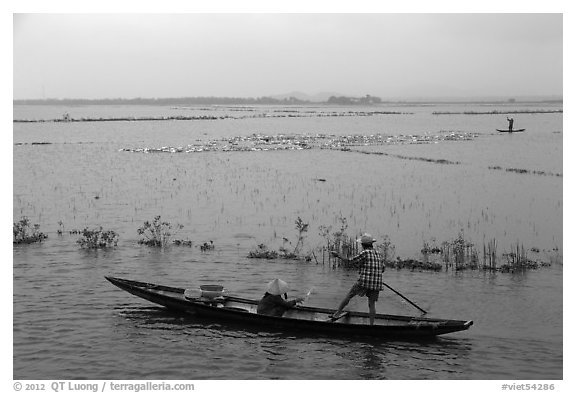 Villagers on flooded fields. Hue, Vietnam