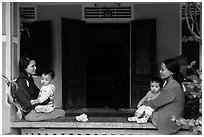 Mothers and infants on porch, Thanh Toan. Hue, Vietnam (black and white)