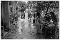 Canalside street with bicyclists and food stand, Thanh Toan. Hue, Vietnam ( black and white)
