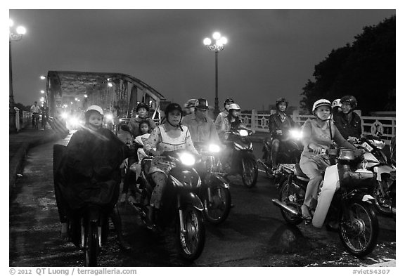 Mtorcylists by night, Trang Tien Bridge. Hue, Vietnam (black and white)