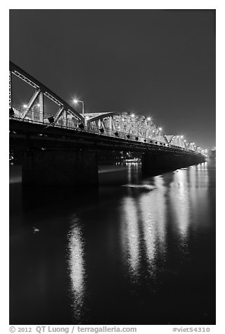 Trang Tien Bridge lights reflected in Perfume River. Hue, Vietnam