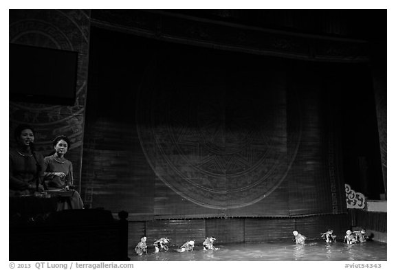 Musicians and water puppets during performance, Thang Long Theatre. Hanoi, Vietnam (black and white)