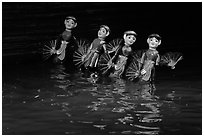 Water puppets (4 characters with fans), Thang Long Theatre. Hanoi, Vietnam (black and white)