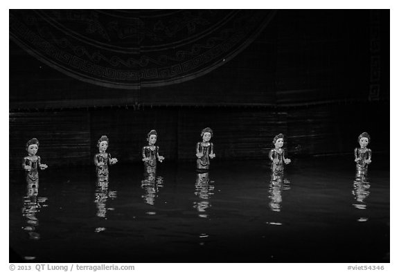 Water puppets (6 characters with lotus), Thang Long Theatre. Hanoi, Vietnam (black and white)