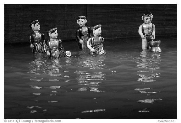 Water puppets (5 characters with musical instruments), Thang Long Theatre. Hanoi, Vietnam (black and white)