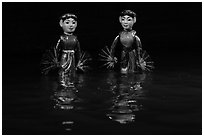 Water puppets (2 characters with fans), Thang Long Theatre. Hanoi, Vietnam (black and white)