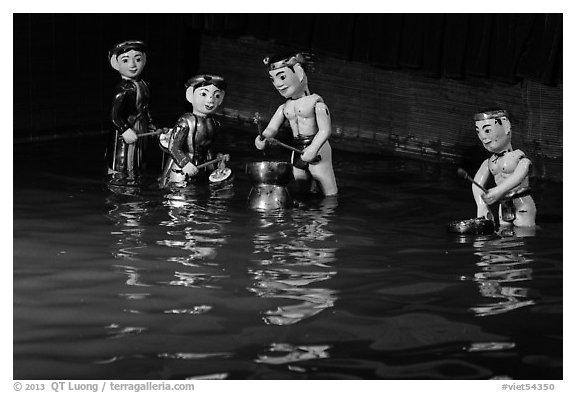 Water puppets (4 characters with musical instruments), Thang Long Theatre. Hanoi, Vietnam (black and white)