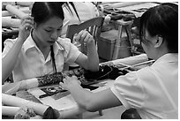 Women in silk embroidery factory. Vietnam (black and white)