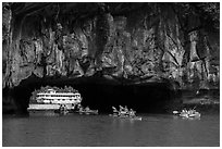 Kayaks floating through Luon Can tunnel. Halong Bay, Vietnam (black and white)