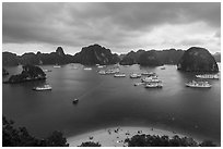 Crescent beach, boats and karst, Titov Island. Halong Bay, Vietnam ( black and white)