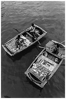 Vendors on boats seen from above. Halong Bay, Vietnam (black and white)