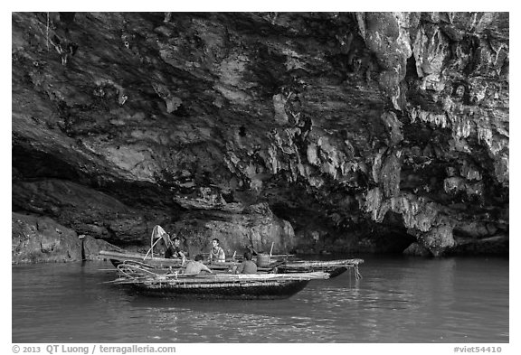 Fishermen anchor in cave for breakfast. Halong Bay, Vietnam (black and white)