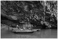 Fishermen anchor in cave for breakfast. Halong Bay, Vietnam ( black and white)