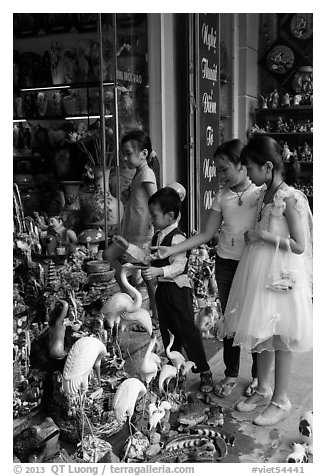 Children checkout ceramic store. Bat Trang, Vietnam (black and white)