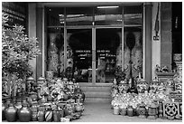 Ceramic store front with vases of all sizes. Bat Trang, Vietnam (black and white)