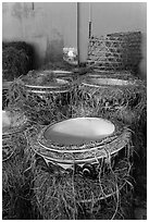 Ceramic vases wrapped in hay in storeroom. Bat Trang, Vietnam (black and white)