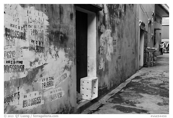 Alley with lots of painted numbers. Bat Trang, Vietnam (black and white)