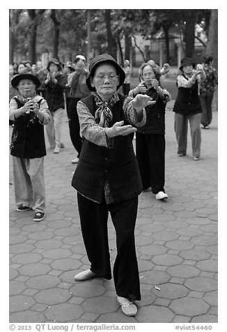 Elderly women practising Tai Chi. Hanoi, Vietnam (black and white)