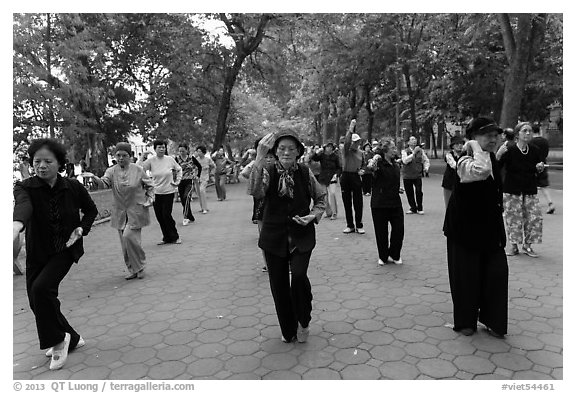 Group of women practising Tai Chi on Hoang Kiem lakeshore. Hanoi, Vietnam (black and white)