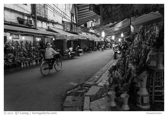 Street with flower sellers in early morning, old quarter. Hanoi, Vietnam (black and white)