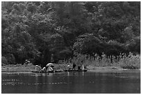 Distant wedding party, Trang An. Ninh Binh,  Vietnam ( black and white)