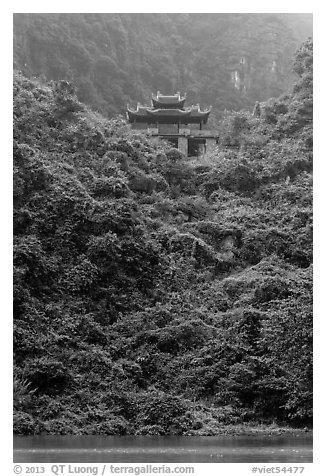 Temple perched on lush hill, Trang An. Ninh Binh,  Vietnam