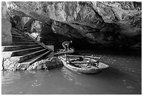 Man readyning a boat inside cave, Trang An. Ninh Binh,  Vietnam ( black and white)
