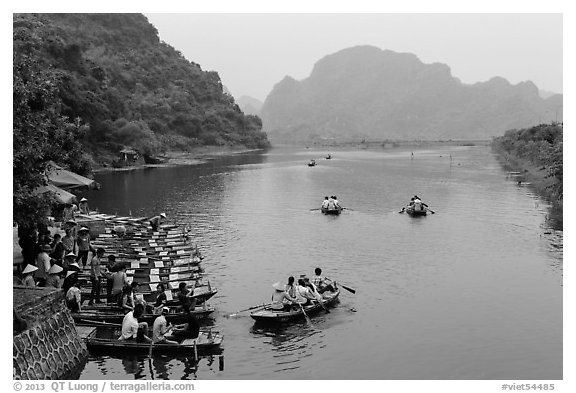 Groups leaving wharf on boats, Trang An. Ninh Binh,  Vietnam