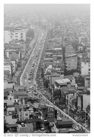 Expressway and buildings in mist seen from above. Hanoi, Vietnam (black and white)