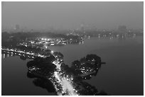 West Lake and city skyline from above by night. Hanoi, Vietnam (black and white)