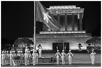 Lowering of flag in front of Ho Chi Minh Mausoleum at night. Hanoi, Vietnam (black and white)