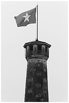 Vietnamese flag flying over flag tower, Hanoi Citadel. Hanoi, Vietnam ( black and white)