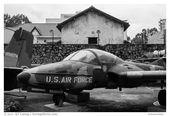 Warplane and wall with barbed wire, War Remnants Museum, district 3. Ho Chi Minh City, Vietnam