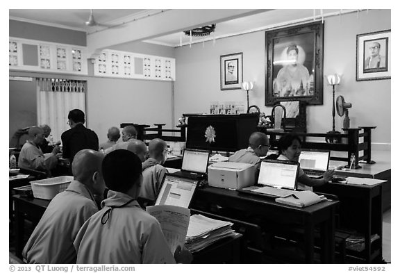 Monks working on computers, An Quang Pagoda, district 10. Ho Chi Minh City, Vietnam (black and white)