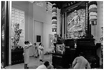 Women worshipping, An Quang Pagoda, district 10. Ho Chi Minh City, Vietnam (black and white)