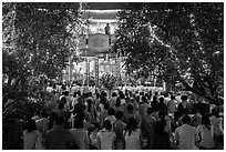 Worshippers at Quoc Tu Pagoda by night, district 10. Ho Chi Minh City, Vietnam (black and white)