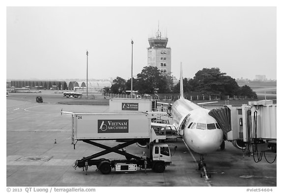 Airliner and control tower, Tan Son Nhat airport, Tan Binh district. Ho Chi Minh City, Vietnam (black and white)