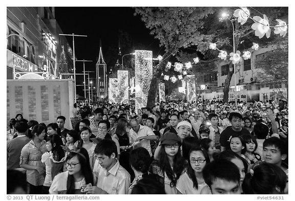 Street filled with crowds on Christmas eve. Ho Chi Minh City, Vietnam (black and white)